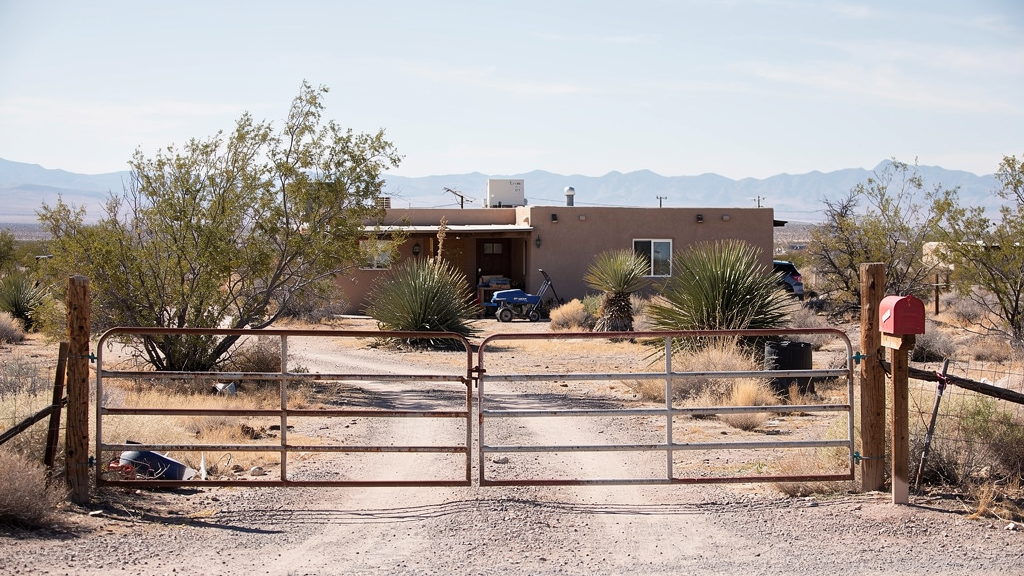 Quiet residential property and front gate in Doña Ana County near Las Cruces